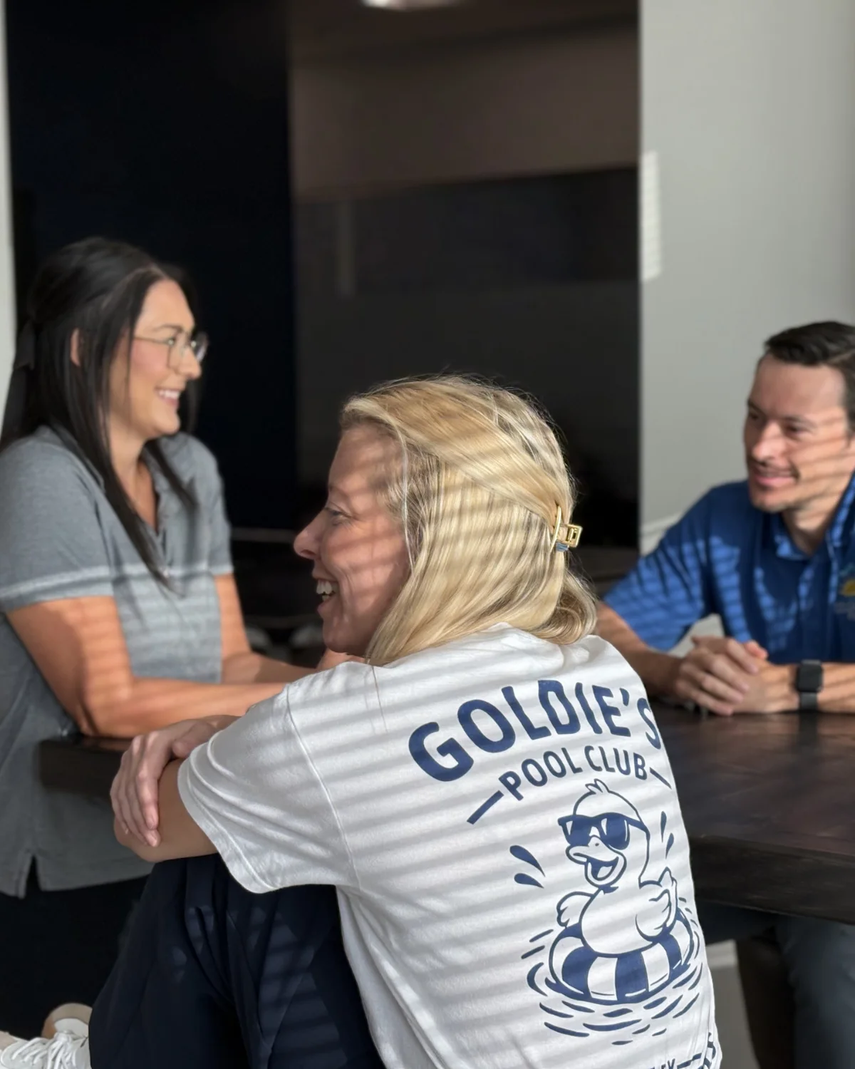 Gold Medal Pools team members collaborating on site